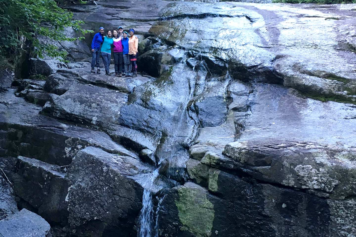 Wild Team by a Waterfall